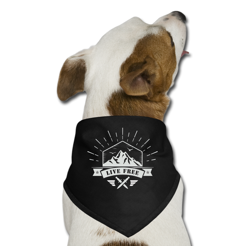 A dog wearing black bandana displaying live free logo